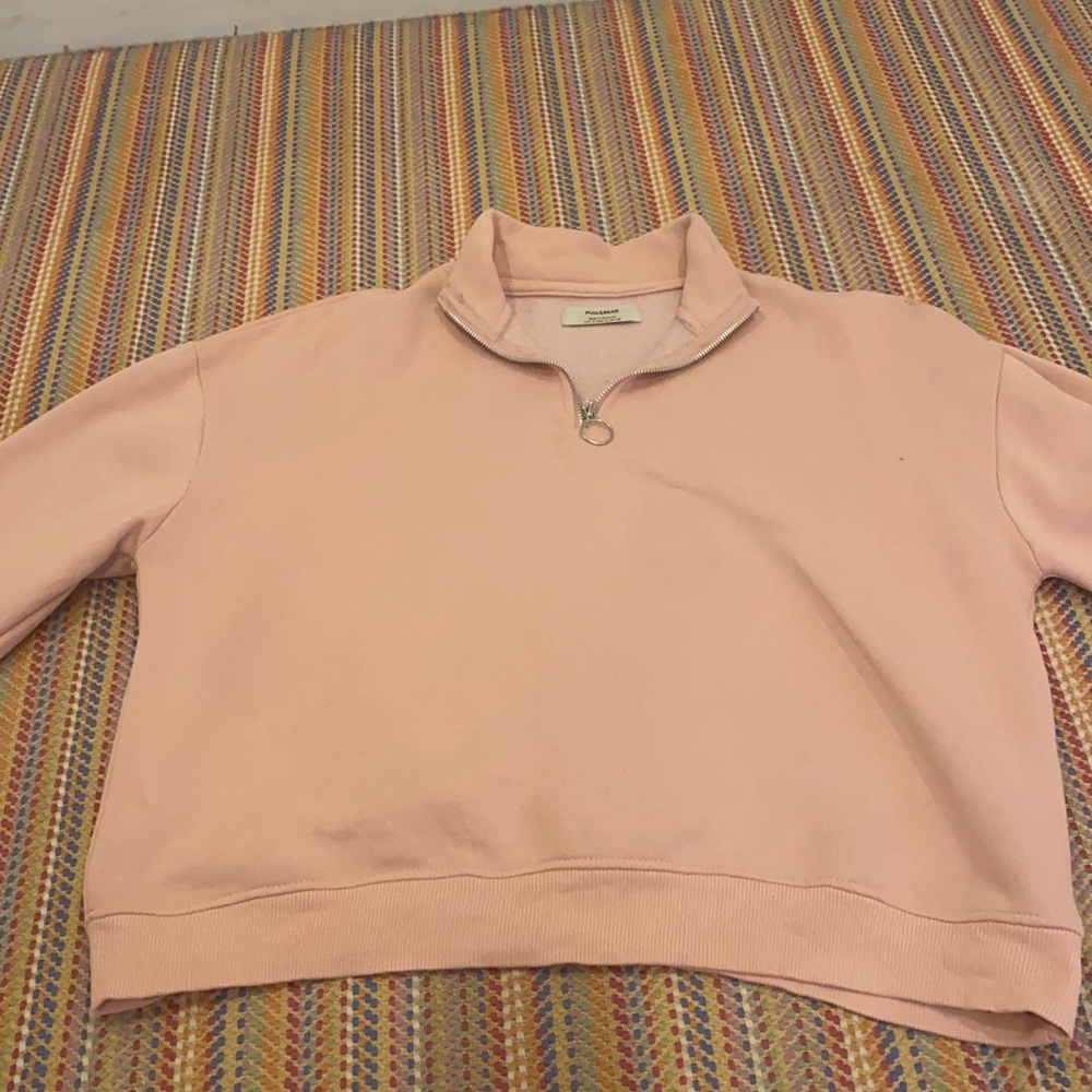 pink half zipped
